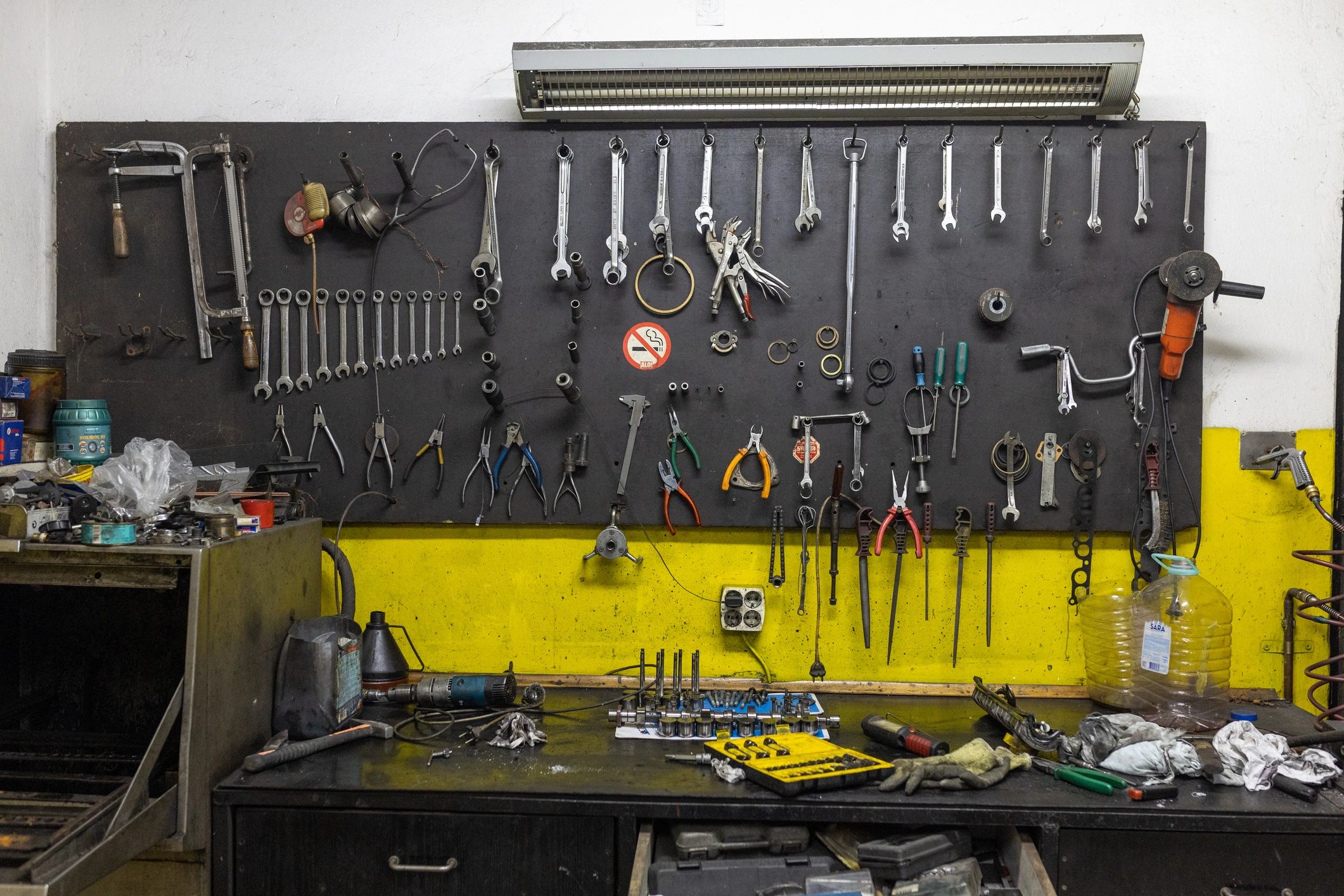 Hand tools organized on a workshop wall