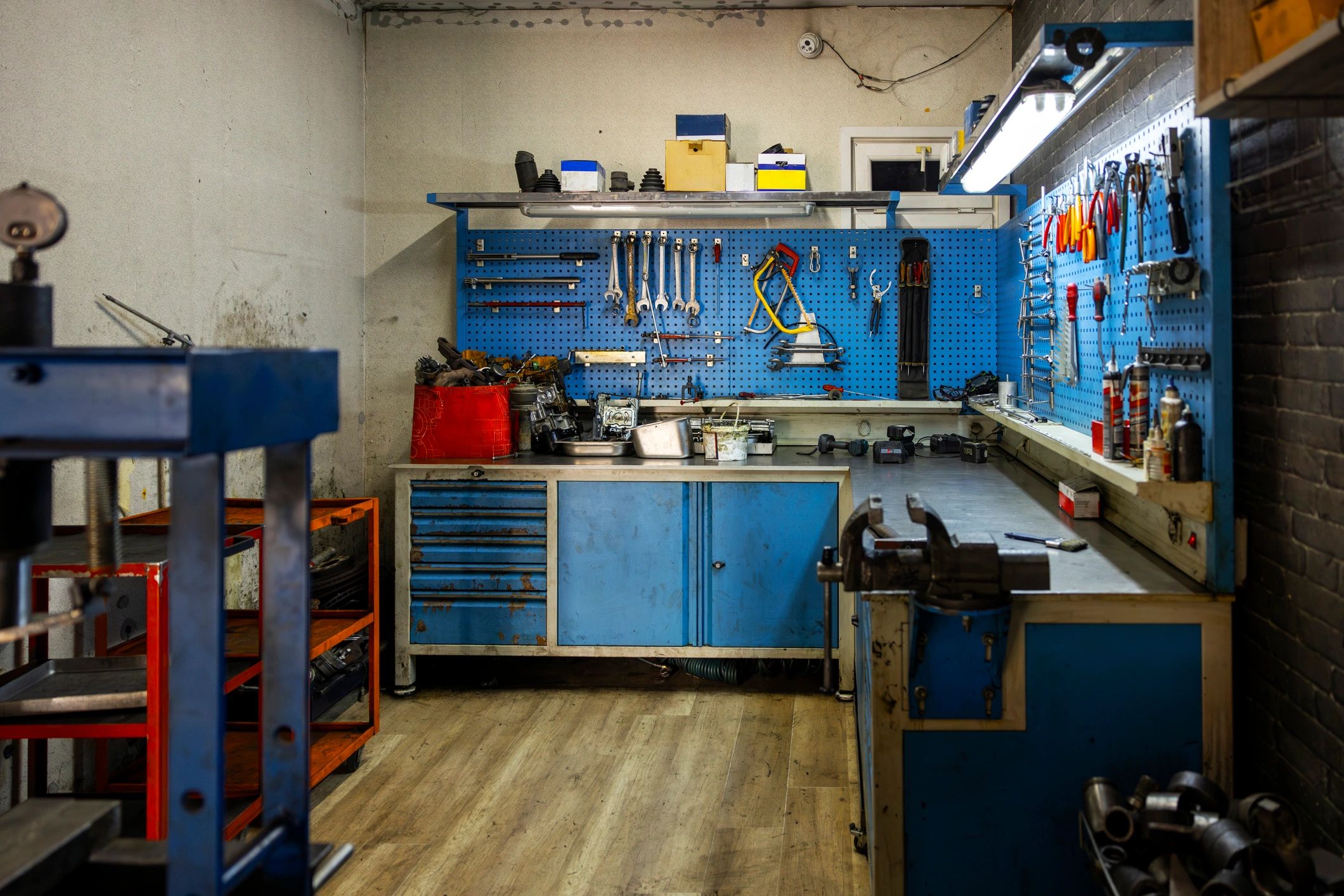 Mechanic workbench tools hanging on a wall